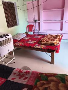 Ένα ή περισσότερα κρεβάτια σε δωμάτιο στο vijay singh rural homestay