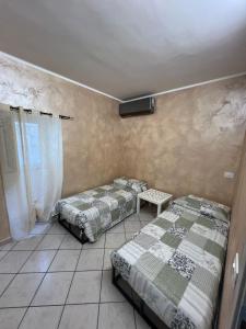 Postel nebo postele na pokoji v ubytování Agherè