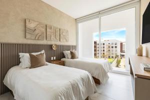 Ένα ή περισσότερα κρεβάτια σε δωμάτιο στο Casa at Marea +43 φωτογραφίες