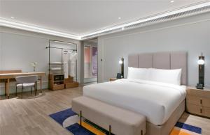 Postel nebo postele na pokoji v ubytování Mercure Guangzhou Nansha + 57 fotografií