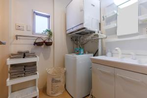 Kuchyň nebo kuchyňský kout v ubytování 本部町 最大12名宿泊可 無料駐車場2台付き 家族 グループに最適 Terrace Motobu + 45 fotografií