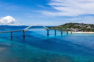a bridge over a large body of water at 本部町 最大12名宿泊可 無料駐車場2台付き 家族 グループに最適 Terrace Motobu in Motobu +45 photos
