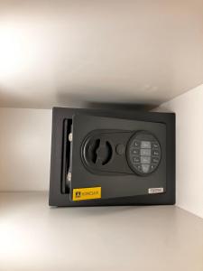 a microwave oven sitting on top of a counter at Li Amber Apartment Carnikava in Carnikava