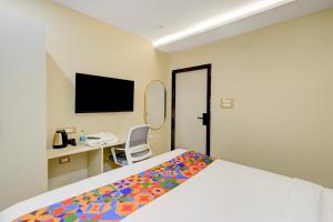 Ένα ή περισσότερα κρεβάτια σε δωμάτιο στο FabHotel Mio