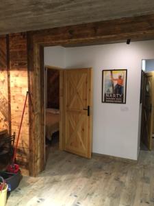 Una cama o camas en una habitación de Apartament Bukowy by Domki Tatry