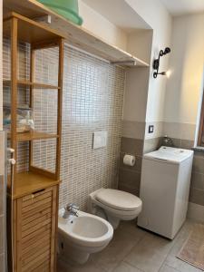 Ένα μπάνιο στο Appartamenti Sasso Rosso +87 φωτογραφίες