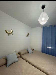 Ένα ή περισσότερα κρεβάτια σε δωμάτιο στο El capricho de Olga