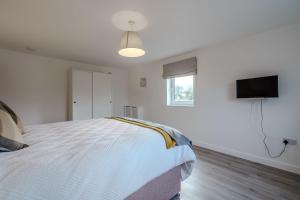 Et tv og/eller underholdning på Rothwill House by Winterton Cottages