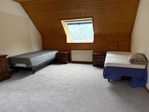 Ένα ή περισσότερα κρεβάτια σε δωμάτιο στο zandhoven vila