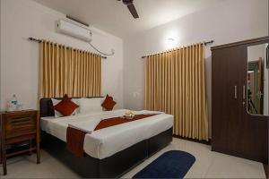 Postel nebo postele na pokoji v ubytování The Boho Cochin