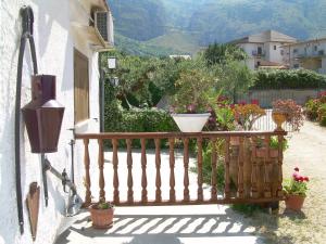 a balcony with potted plants on the side of a building at Casa Vacanza e Camera Fabiola in Castellammare del Golfo