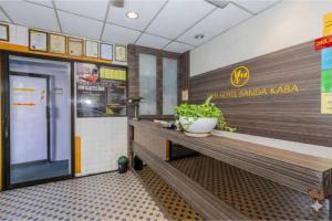 Η κουζίνα ή μικρή κουζίνα στο OYO 91258 Qish Hotel Banda Kaba