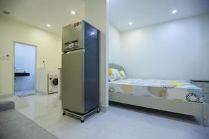 Ένα ή περισσότερα κρεβάτια σε δωμάτιο στο Victoria Hotel And Apartment