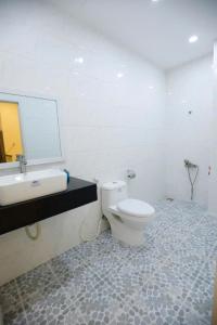 Ένα μπάνιο στο Victoria Hotel And Apartment