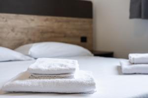 Giường trong phòng chung tại Residence La Luma +1 ảnh