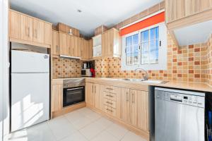 Kuchyň nebo kuchyňský kout v ubytování Bungalow Sunrise Europa