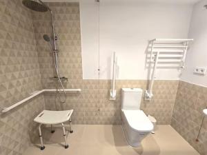 a bathroom with a toilet and a shower and a stool at Playa Sardinero - Little Homes 1-2-3-5 in Santander +81 photos
