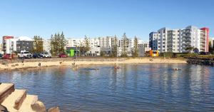 a group of people swimming in a body of water at Rustic, Scandinavian house close to Reykjavik in Garðabær