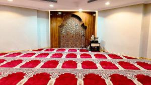 Ένα ή περισσότερα κρεβάτια σε δωμάτιο στο فندق ميزاب أوركيد جرول