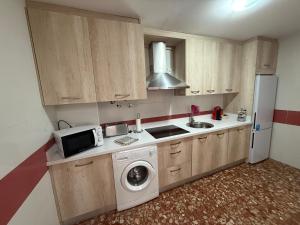 Η κουζίνα ή μικρή κουζίνα στο AVENIDA CENTRO 2 Dormitorios PONDOS