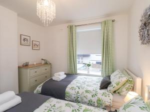 Postel nebo postele na pokoji v ubytování Postmans Lodge