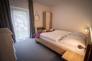 Ένα ή περισσότερα κρεβάτια σε δωμάτιο στο ZORE JASNÁ Apartments +155 φωτογραφίες