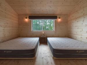 Ένα ή περισσότερα κρεβάτια σε δωμάτιο στο lamp yamanaka-山中湖 河口湖 プライベートヴィラ-132平米-最大10名-BBQ無料-乳幼児可-長期滞在設備充実-山中湖車5分-河口湖車20分 +126 φωτογραφίες