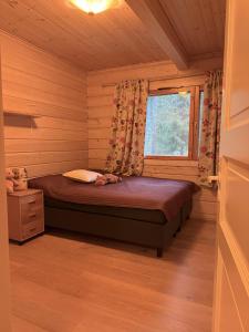 Ένα ή περισσότερα κρεβάτια σε δωμάτιο στο Whispering Pines