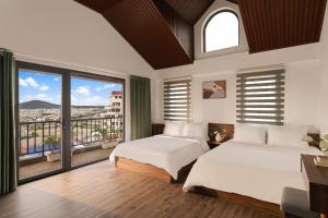 Ένα ή περισσότερα κρεβάτια σε δωμάτιο στο La Forest Villa