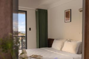 Ένα ή περισσότερα κρεβάτια σε δωμάτιο στο La Forest Villa