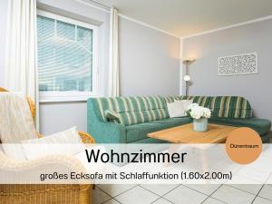 Khu vực ghế ngồi tại Ostsee-Traumferienwohnungen Villa Anika