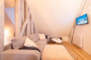 Et tv og/eller underholdning på Historic Rennes Cozy apartment