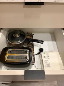 a toaster sitting on top of a counter at Mistera rezidence in Jelgava +9 photos