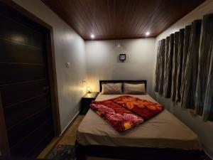 En eller flere senge i et værelse på Talia Farm house