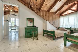 a bedroom with a bed and a table in a room at Sofia - Yiota Studios & Apartments in Tsilivi