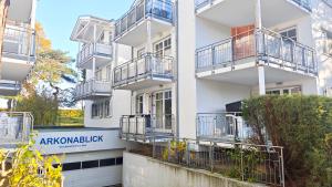 an apartment building with balconies and a sign on it at Ferienwohnung Ostseeblick in Breege