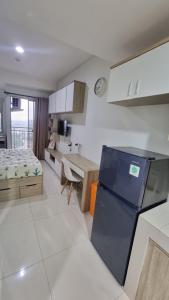 Kuchyň nebo kuchyňský kout v ubytování Apartemen springwood + 14 fotografií
