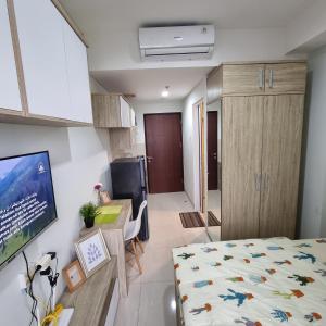 Postel nebo postele na pokoji v ubytování Apartemen springwood