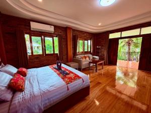 Postel nebo postele na pokoji v ubytování Baantientong