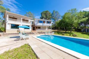 a villa with a swimming pool and a house at YourHouse Can Marques villa in Palma de Mallorca