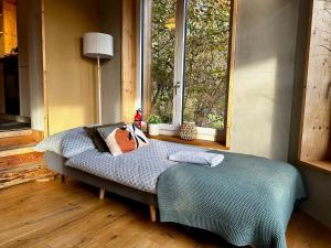 Ένα ή περισσότερα κρεβάτια σε δωμάτιο στο Wohlfühloase im Kanton Zürich