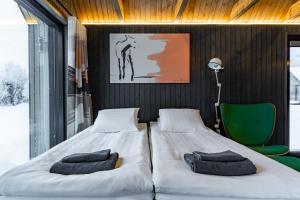 Postel nebo postele na pokoji v ubytování Nilimella - Lapland resort & camping