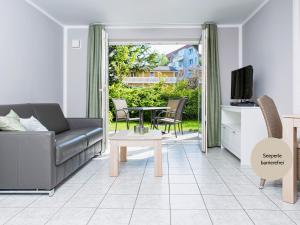 TV/trung tâm giải trí tại Ostsee-Traumferienwohnungen Villa Anika