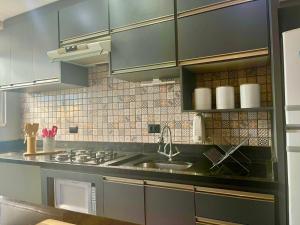 Η κουζίνα ή μικρή κουζίνα στο Apê Palhano & Faria Lima +24 φωτογραφίες