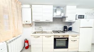 Η κουζίνα ή μικρή κουζίνα στο Sweet Apartment by Ca-Sa Check