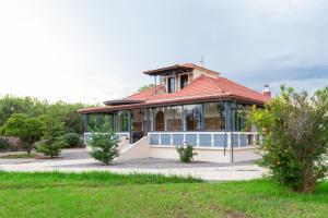 Κήπος έξω από το Villa Psani - Beachfront Escape with Garden