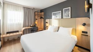 Ένα ή περισσότερα κρεβάτια σε δωμάτιο στο Campanile PRIME - Lyon Ouest Tassin +35 φωτογραφίες