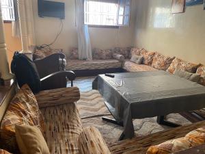 a living room with a couch and a table at Rest in Agadir