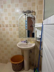a bathroom with a sink and a mirror at Rest in Agadir