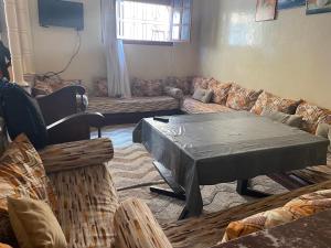 a living room with a couch and a table at Rest in Agadir